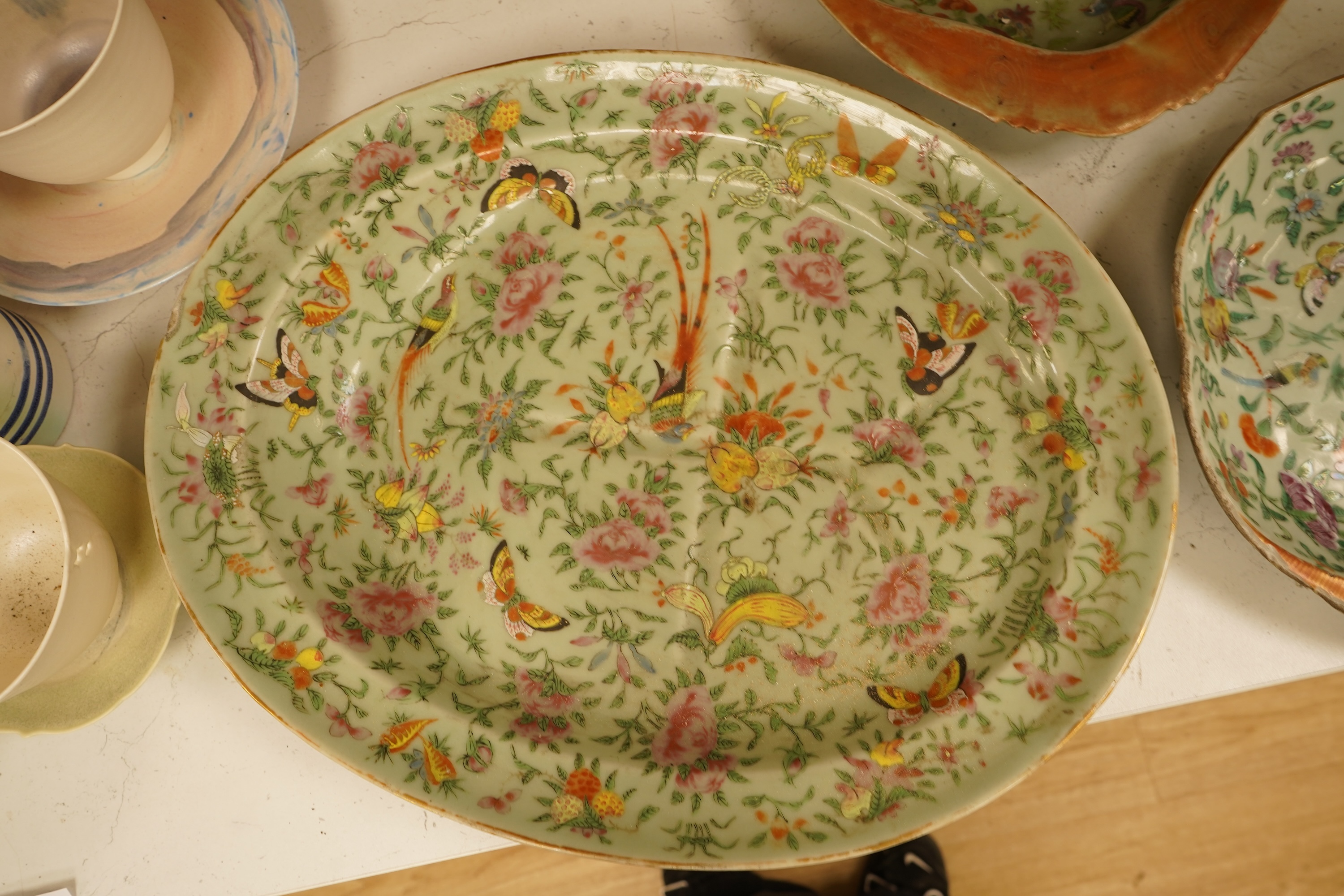 A Chinese celadon ground famille rose dish and two similar dessert dishes, c.1830, meat dish 42cm wide